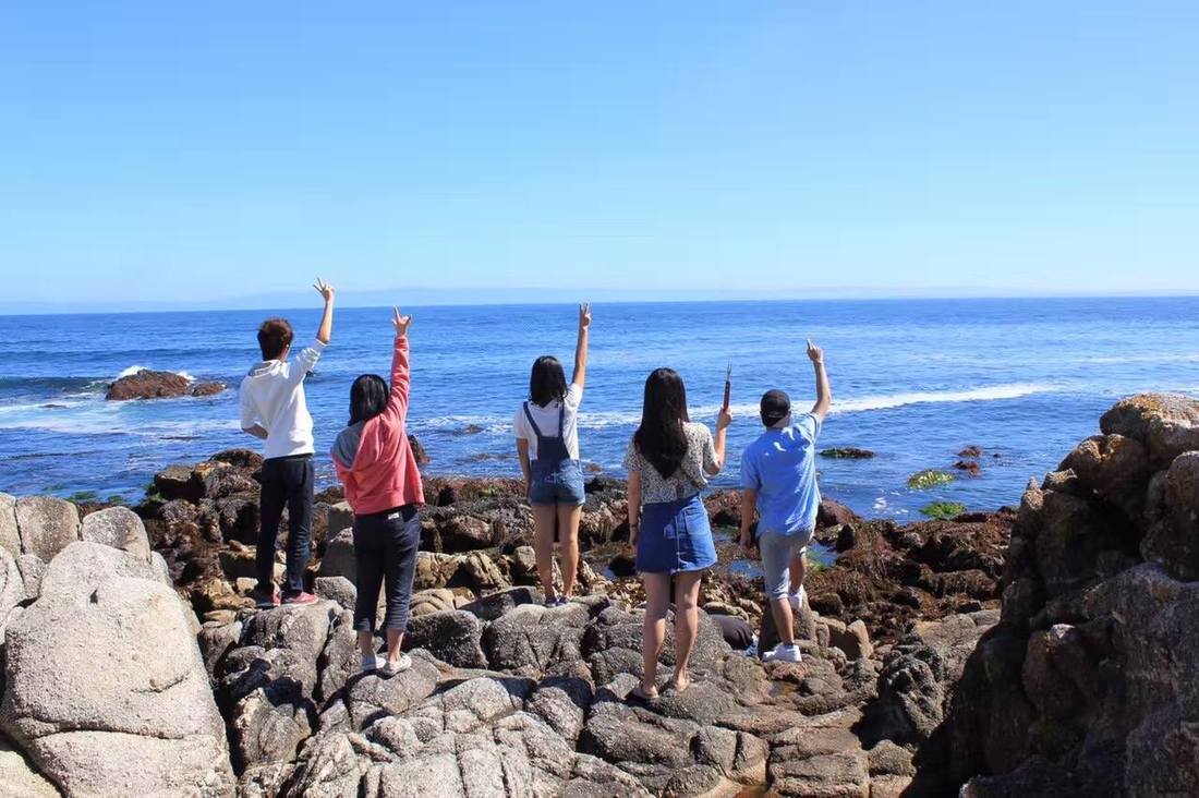 students by the ocean